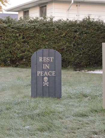 wood gravestones in frosty grass