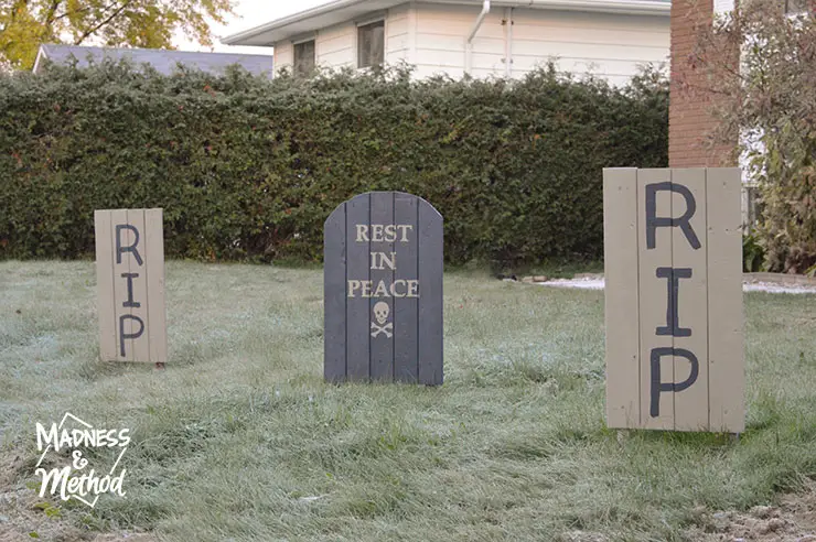 wood gravestones in frosty grass