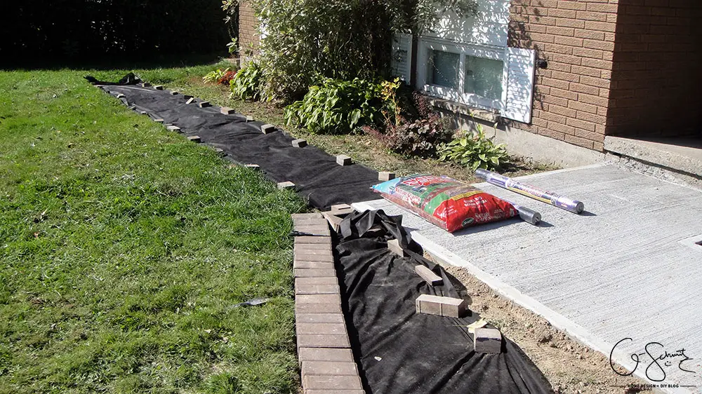 Can you believe this area was just grass and a chain link fence before? Here is the story of how we finished our side yard landscaping :)