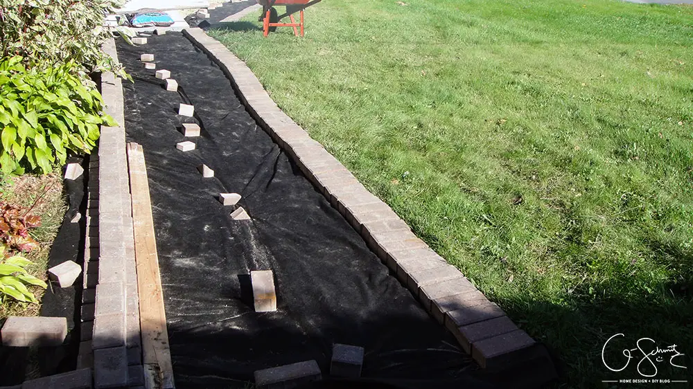 Can you believe this area was just grass and a chain link fence before? Here is the story of how we finished our side yard landscaping :)