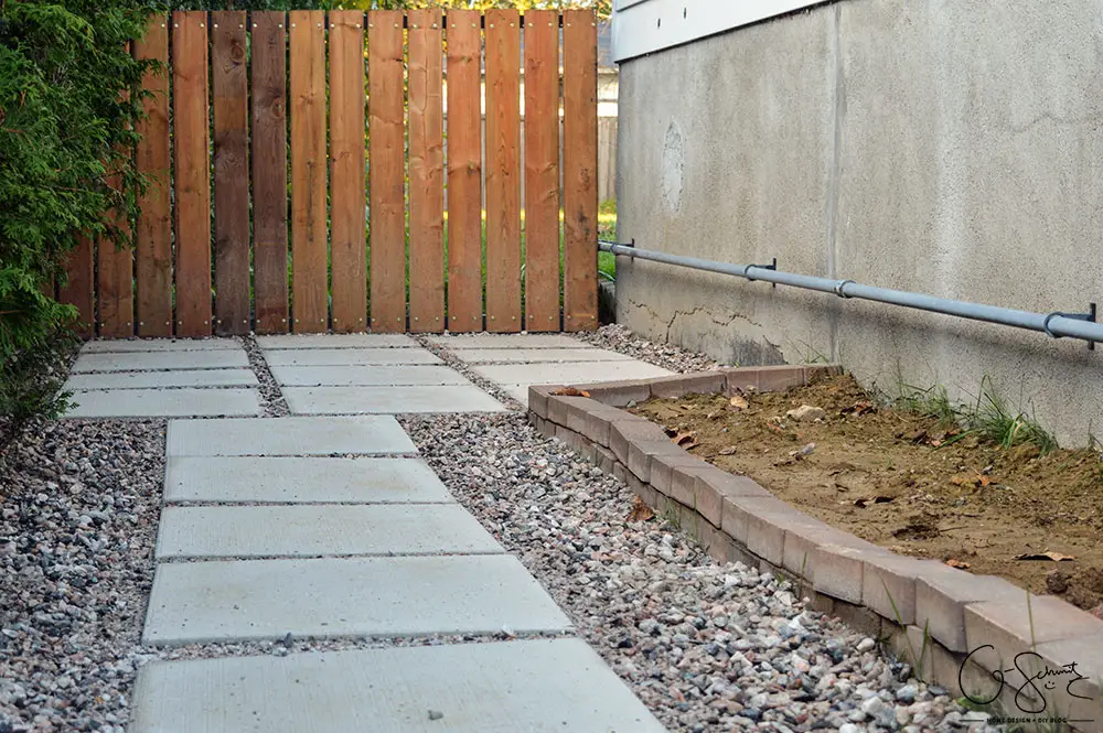 Can you believe this area was just grass and a chain link fence before? Here is the story of how we finished our side yard landscaping :)