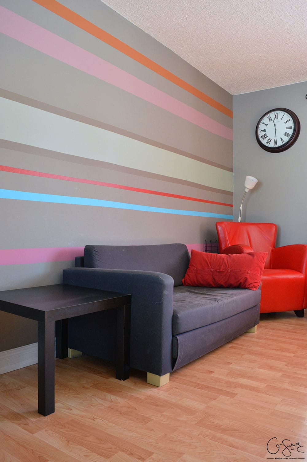 The living and dining room are two combined spaces in our house. Check out pictures of these two areas and the striped accent wall that joins them both together. 