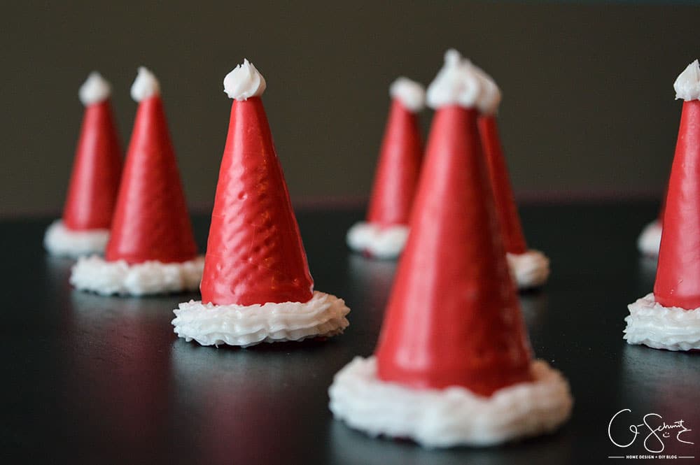 I just completed these super easy custom ice cream cone Santa hats (and snowman hats, and Christmas trees!) and thought I should share how I made them!