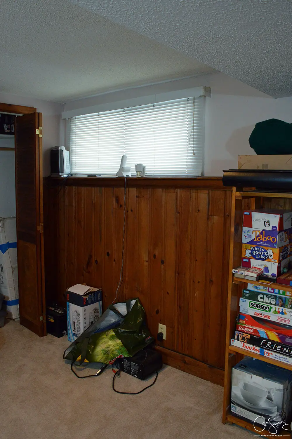 My basement is definitely "country". Think plaid and dark wood paneling, and that pretty much describes this space. You know what style I am not? Country! But, let's look at pictures of the basement anyways, along with my lovely little comments of issues I would change...