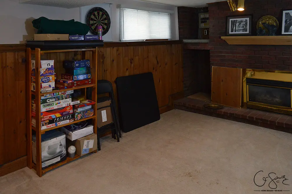 My basement is definitely "country". Think plaid and dark wood paneling, and that pretty much describes this space. You know what style I am not? Country! But, let's look at pictures of the basement anyways, along with my lovely little comments of issues I would change...