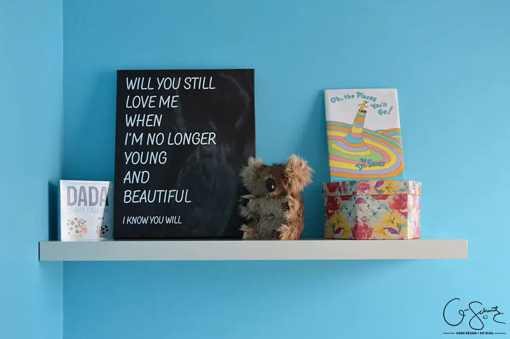 I designed this custom graphic canvas using the image from my baby’s ultrasound and some song lyrics. It is the perfect addition to our minimalist nursery.