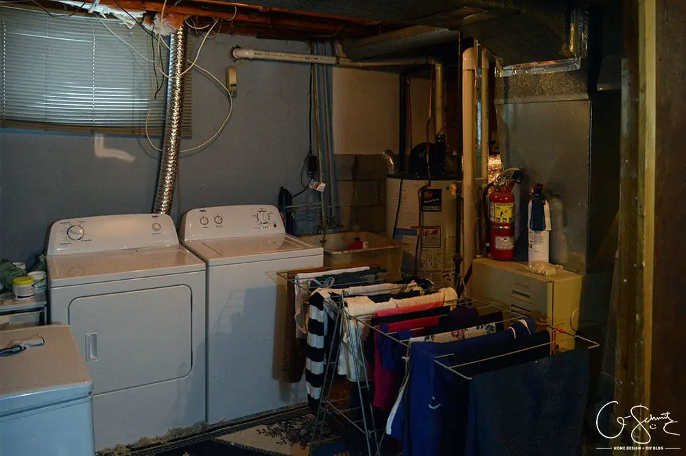 Our unfinished laundry room is dark, dingy, cobweb-y and rough... but every place needs a starting point - at least it's functional :)