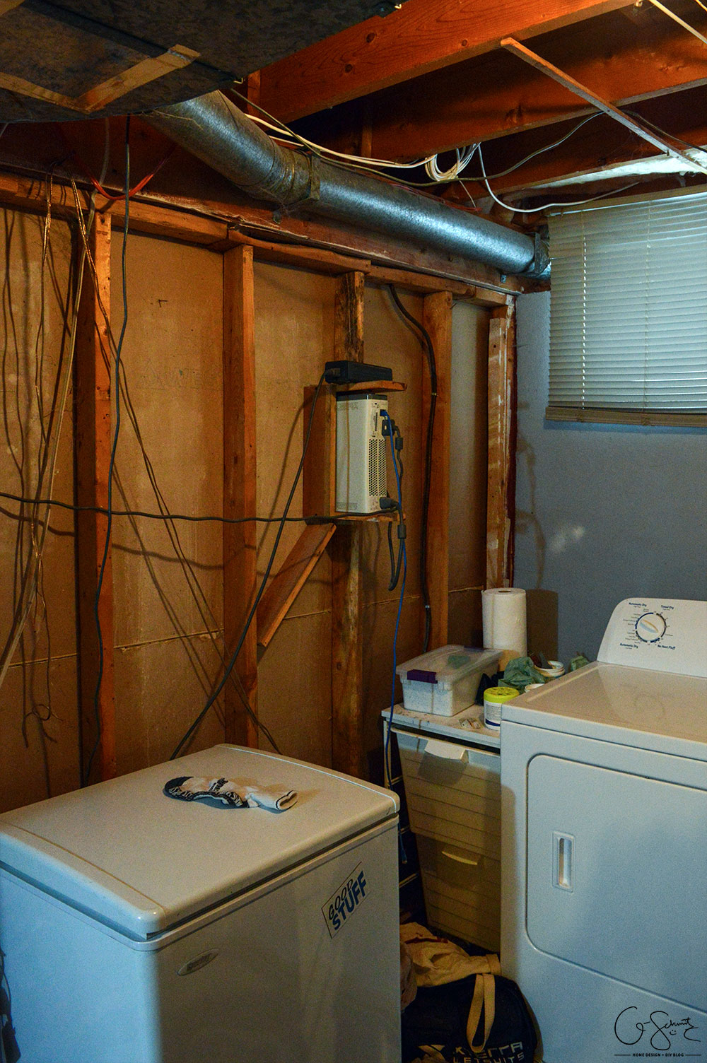 Our unfinished laundry room is dark, dingy, cobweb-y and rough... but every place needs a starting point - at least it's functional :)