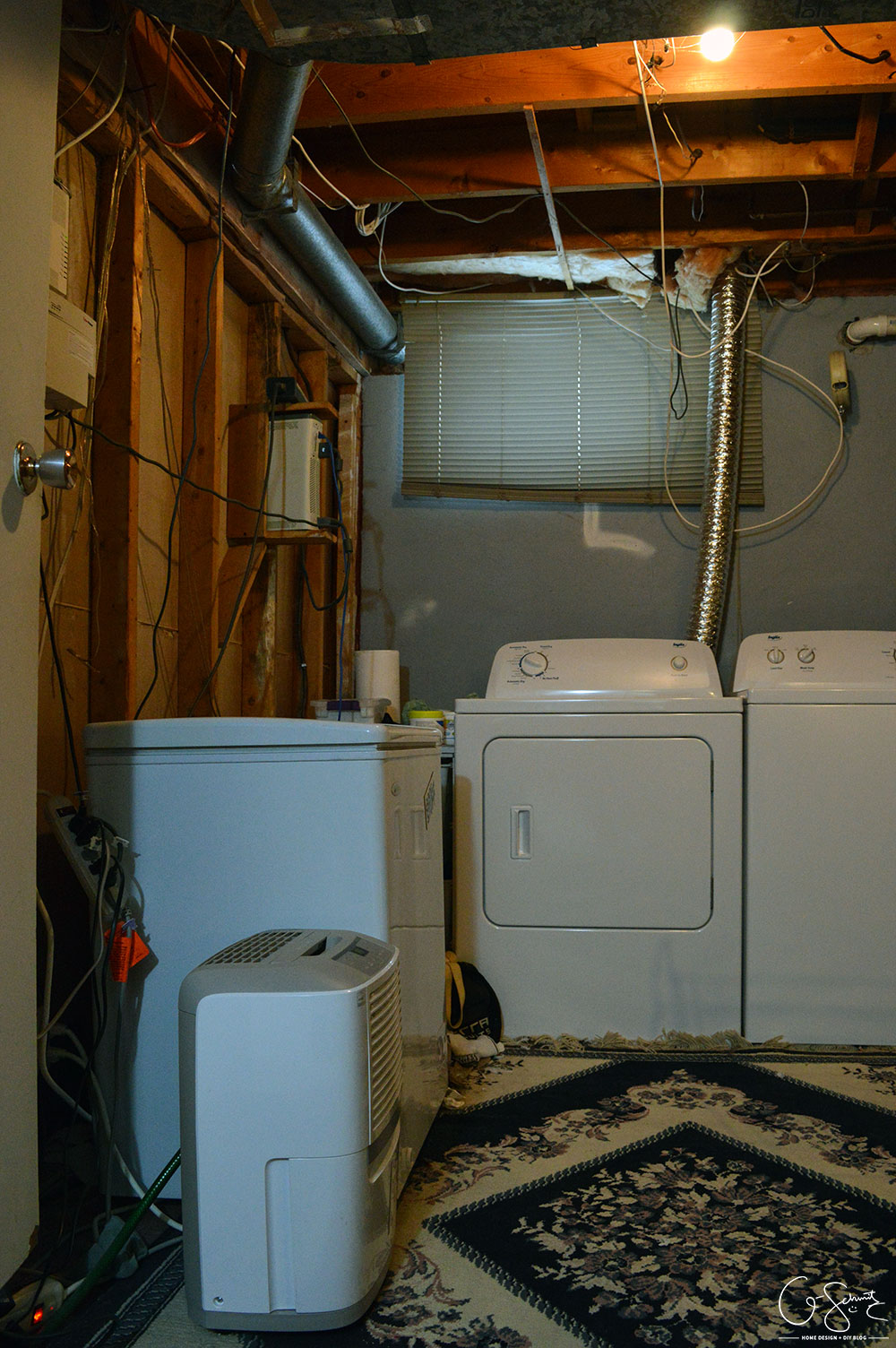 Our unfinished laundry room is dark, dingy, cobweb-y and rough... but every place needs a starting point - at least it's functional :)