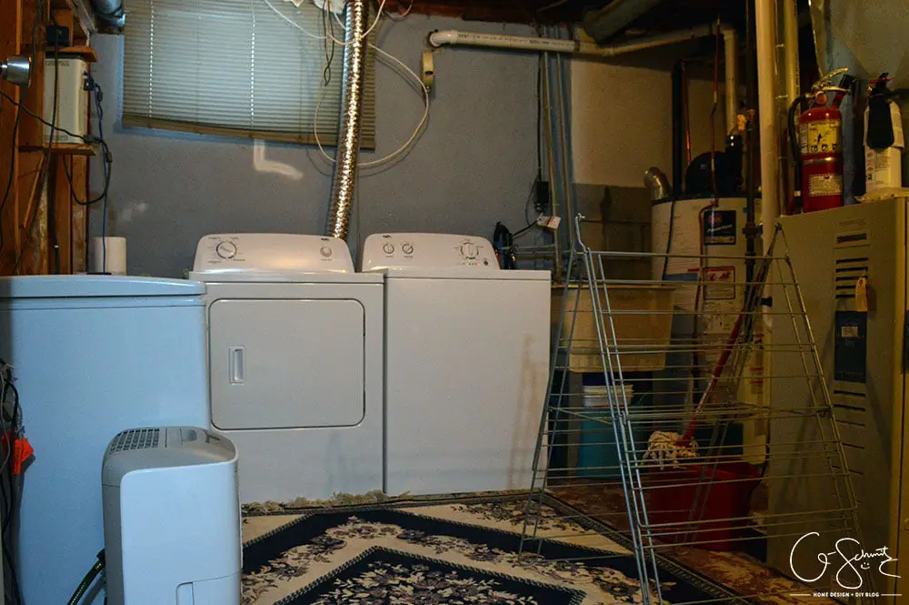 Our unfinished laundry room is dark, dingy, cobweb-y and rough... but every place needs a starting point - at least it's functional :)