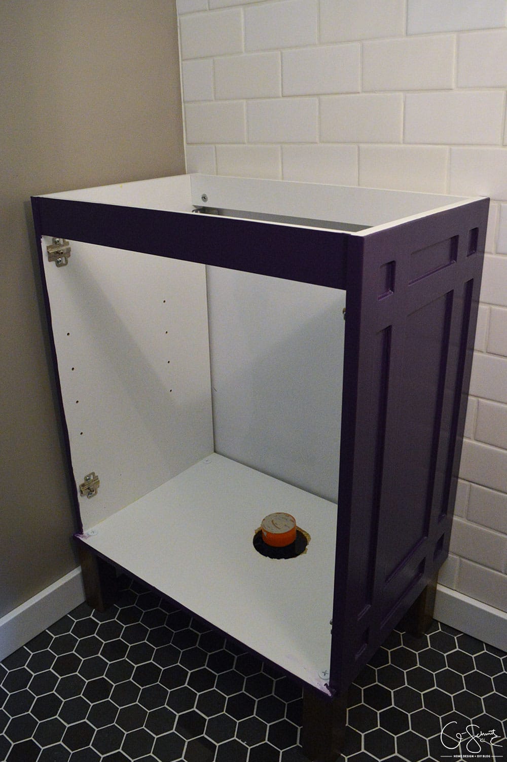 For our basement half-bathroom addition, I created a custom Ikea vanity using the Ikea Fullen sink cabinet. And it's bright purple!