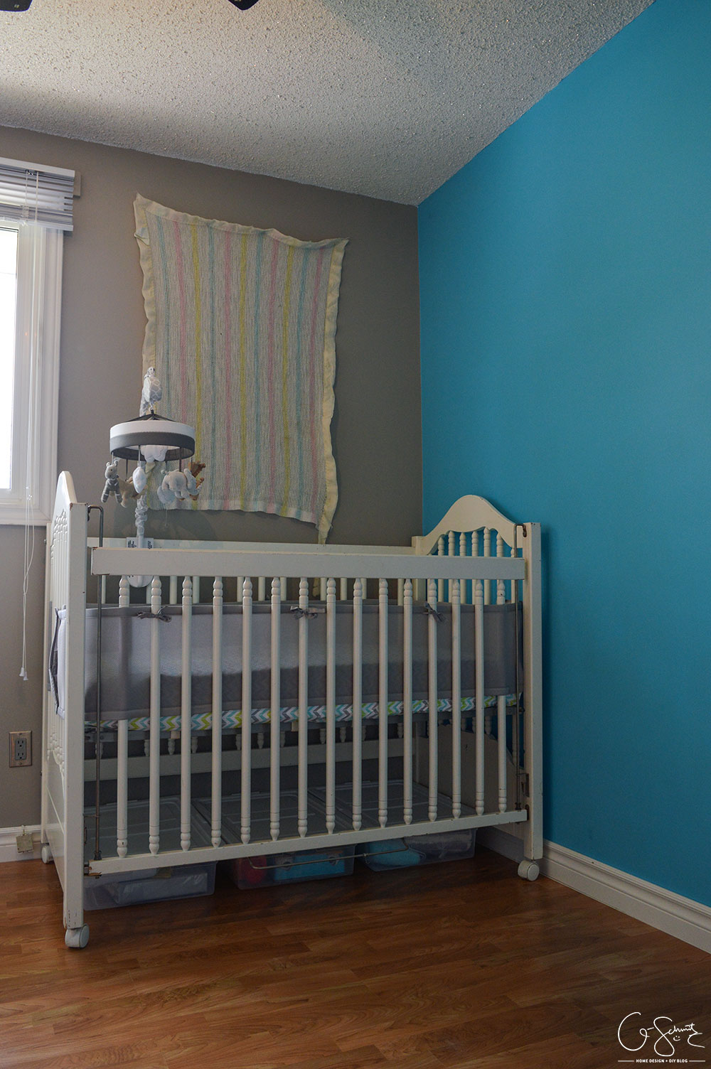 I finished our neutral nursery, and I’ve got all the essentials (crib, rocking chair, change table)… but would you mind helping decide if we need a rug?