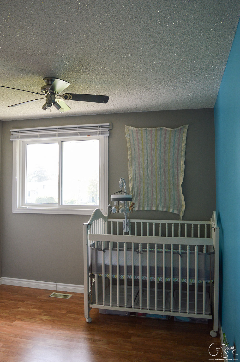 I finished our neutral nursery, and I’ve got all the essentials (crib, rocking chair, change table)… but would you mind helping decide if we need a rug?