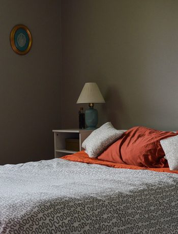 what was once an office is now a simple guest bedroom (with a surprising accent wall in pink!). I like to call it a simple guest bedroom, because really - all there is to it is a bed, nightstand, and your basic necessities. No cool theme, no rhyme or reason to how it is decorated... just a little place for guests to come spend the night.