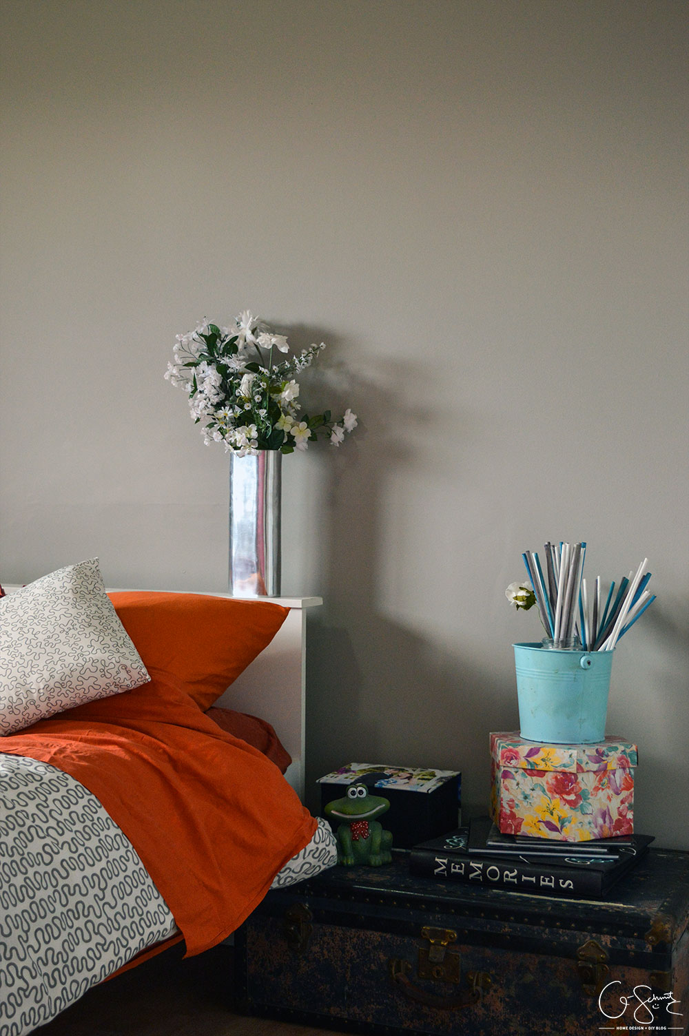 What was once an office is now a simple guest bedroom (with a surprising accent wall in pink!). I like to call it a simple guest bedroom, because really - all there is to it is a bed, nightstand, and your basic necessities. No cool theme, no rhyme or reason to how it is decorated... just a little place for guests to come spend the night.