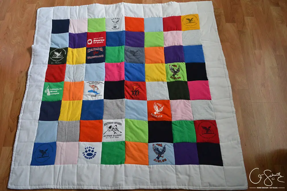 If you're someone like me that's held on to some old t-shirts and wanted to put them to good use, then you can certainly use this idea! Check out how I was able to repurpose years’ worth of (mostly) free clothing to create a custom t-shirt baby quilt.