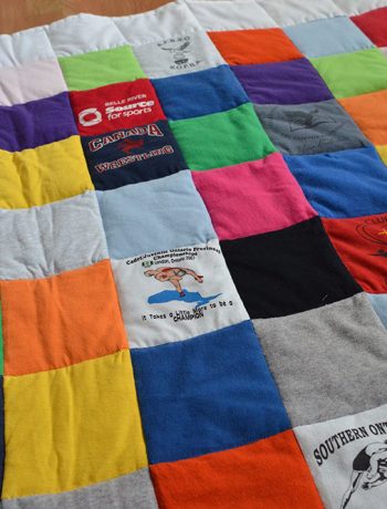 If you're someone like me that's held on to some old t-shirts and wanted to put them to good use, then you can certainly use this idea! Check out how I was able to repurpose years’ worth of (mostly) free clothing to create a custom t-shirt baby quilt.