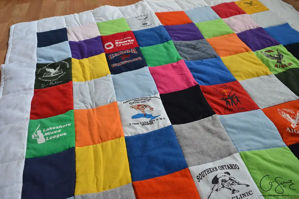 If you're someone like me that's held on to some old t-shirts and wanted to put them to good use, then you can certainly use this idea! Check out how I was able to repurpose years’ worth of (mostly) free clothing to create a custom t-shirt baby quilt.