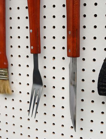 We recently installed a super easy DIY BBQ Pegboard which is great for holding all our barbecue related tools! Let me show you what I mean…