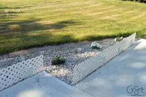 Check out these cute and easy trellis mini-fences that I wanted to install to add height and definition to the flowerbed along our front walkway.