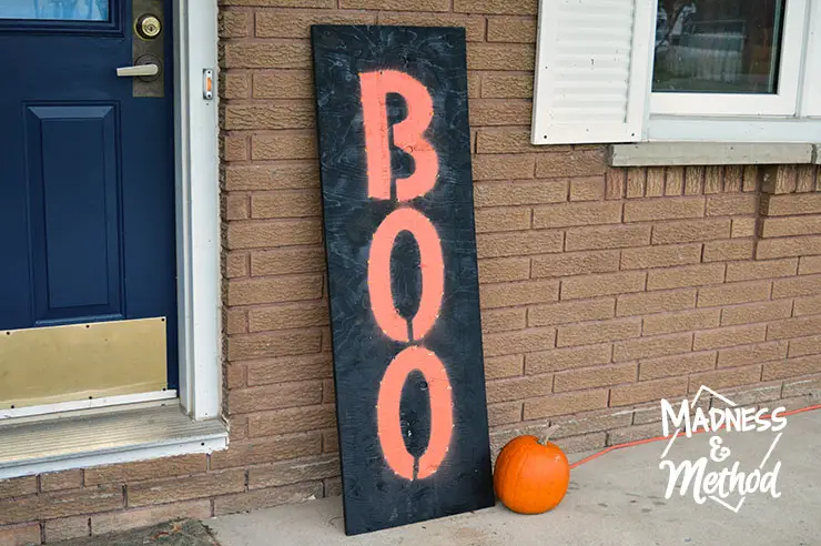 I made a custom DIY light up board "Boo" sign because I wanted something that would look good in both the daytime and at night. This large marquee-like sign is the perfect addition to our front porch!