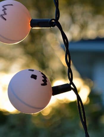 Were you too lazy to take down your Christmas lights last year? Might as well incorporate them into your Halloween décor as pumpkin ping pong lights!