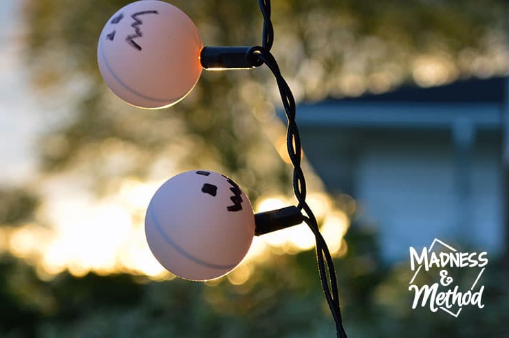 Were you too lazy to take down your Christmas lights last year? Might as well incorporate them into your Halloween décor as pumpkin ping pong lights!