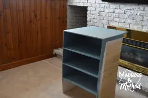I had the idea to turn the unused hole near our fireplace into usable storage and decided to build a custom game shelf to hold all our board games!