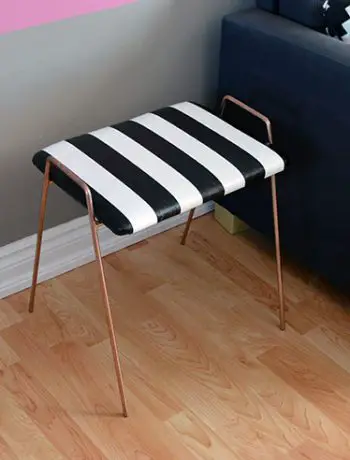 I LOVE how this striped stool makeover fits in perfectly with the black and white décor I have in the upstairs living room. I had originally purchased the stool for another DIY, but I'm happy I changed my mind - let me show you what I mean.