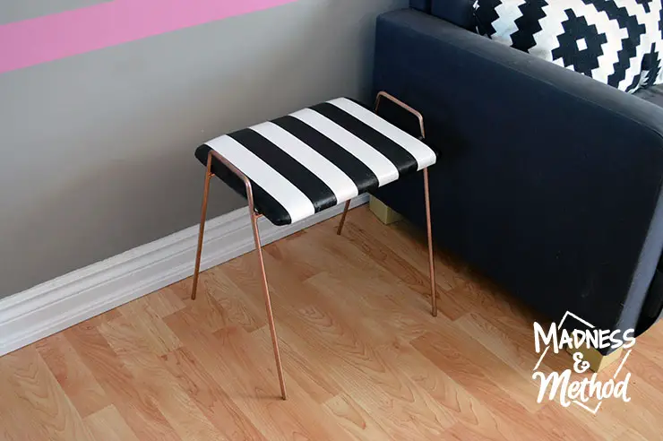 I LOVE how this striped stool makeover fits in perfectly with the black and white décor I have in the upstairs living room. I had originally purchased the stool for another DIY, but I'm happy I changed my mind - let me show you what I mean.