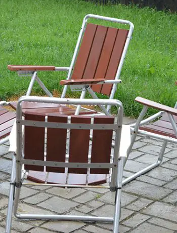 Antique patio chairs on concrete patio