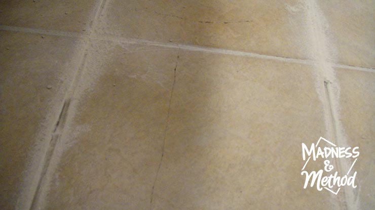 replace a cracked tile by removing grout