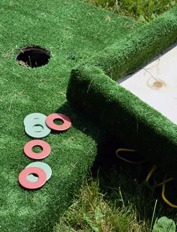 Washer toss game closeup of washers and board