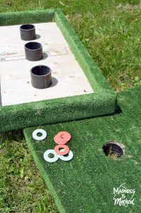 flipping a washer toss game board over