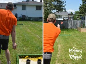 playing a washer toss game with three pipes