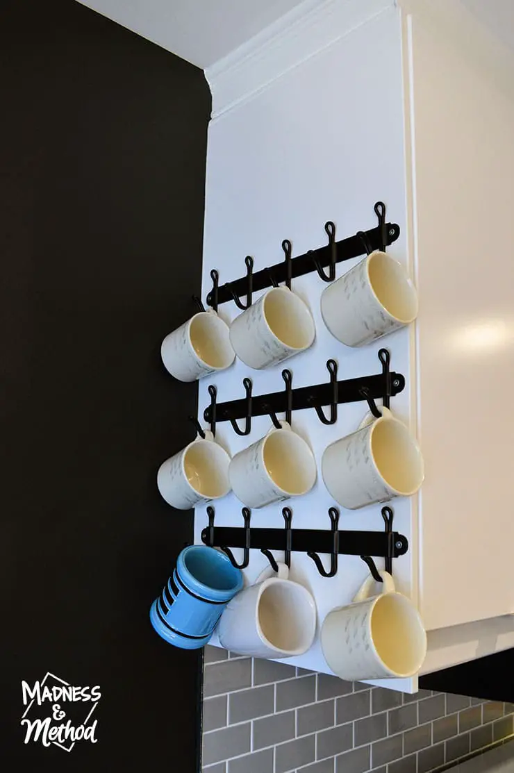 hanging mugs on side of cabinet