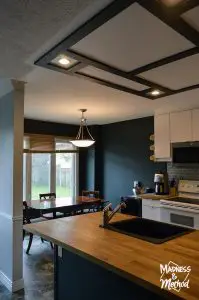 black and white kitchen reveal with faux coffered ceiling