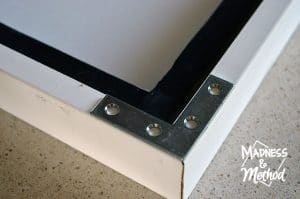 adding brackets to support canvas frame