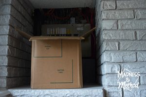electrical panel in fireplace