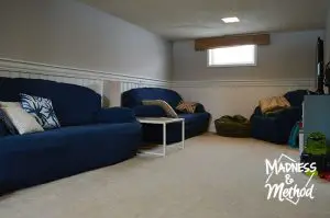navy blue couches in basement family room