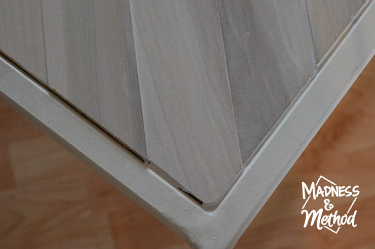 caulking edges of metal and wood coffee table