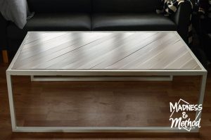 surface of metal and wood coffee table