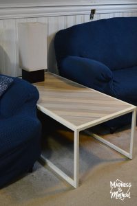 metal and wood coffee table in basement