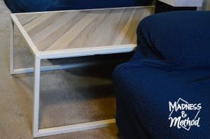 sides of metal and wood coffee table