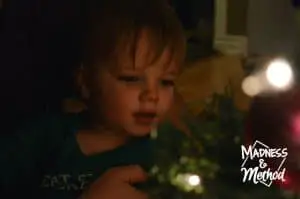 baby looking at christmas tree
