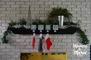 simple silver and green holiday mantel full view