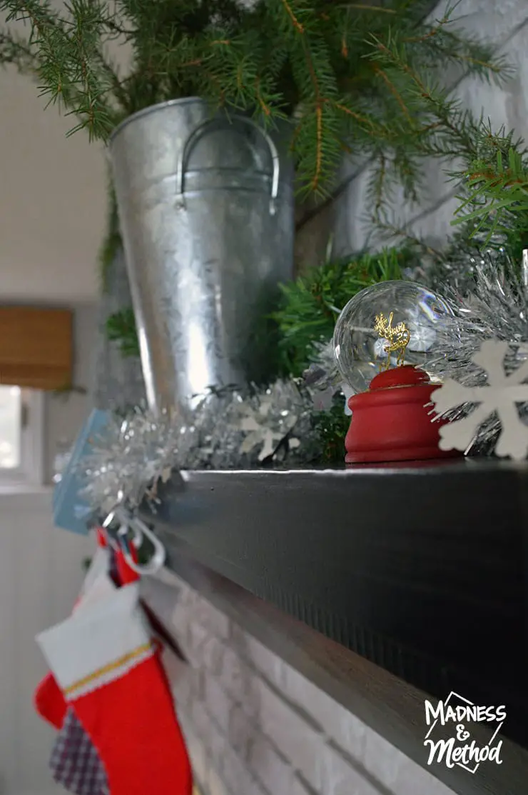 black mantel with holiday decor