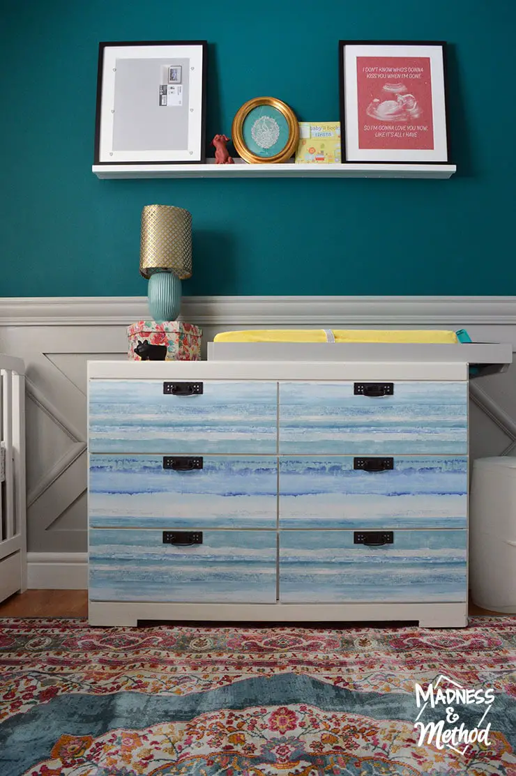 dresser covered in wallpaper