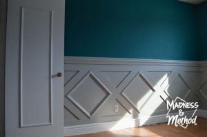 gray diamond wainscoting with white baseboards