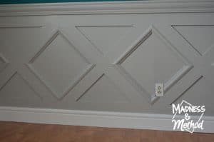 gray wainscoting with white baseboards